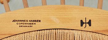 A Hans J Wegner ash and teak 'Peacock chair', Johannes Hansen, Denmark.