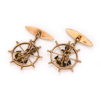 A pair of 14K gold cuff-links.