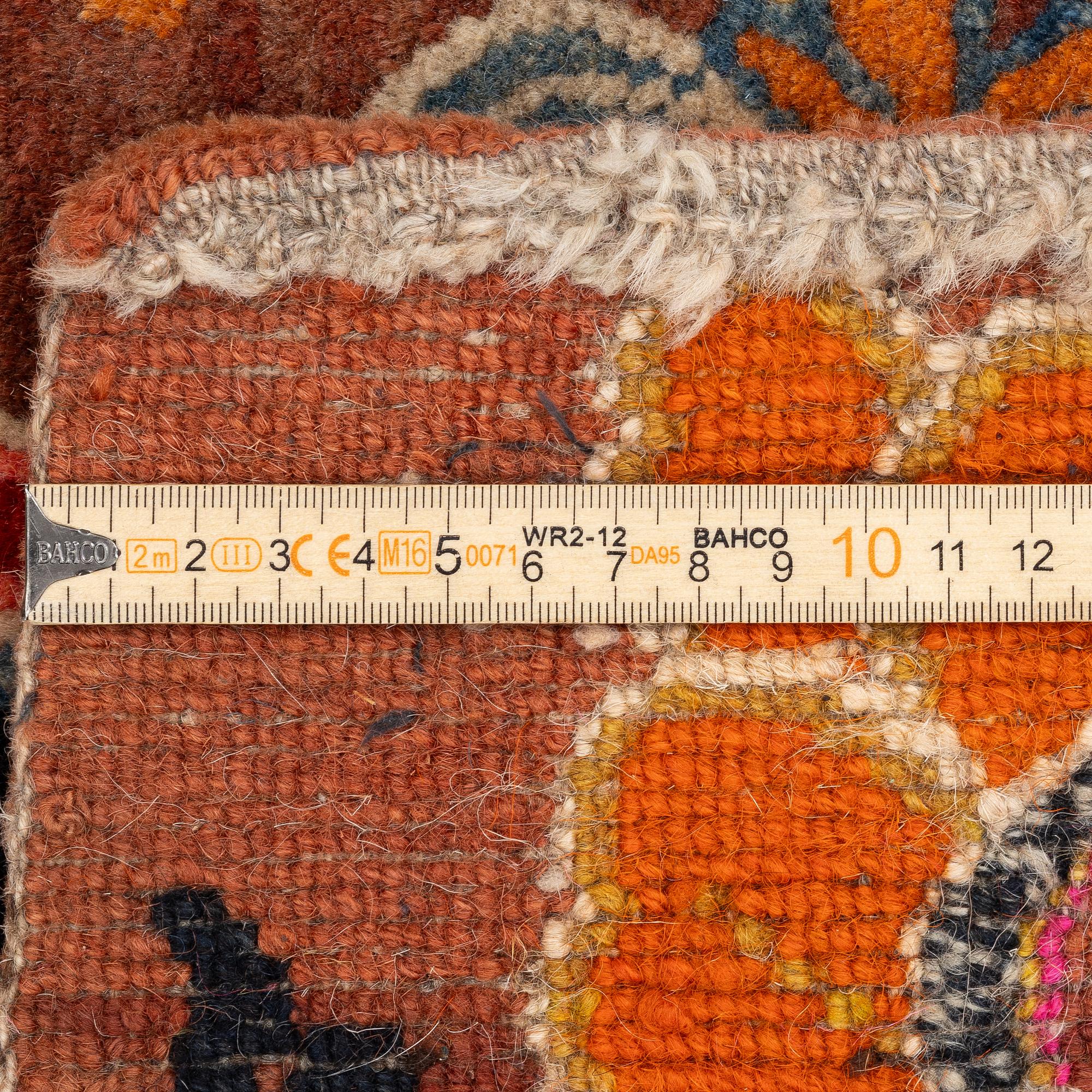 An antique 'Khagangma' rug, Tibet, around 1900. c. 74x63 cm.