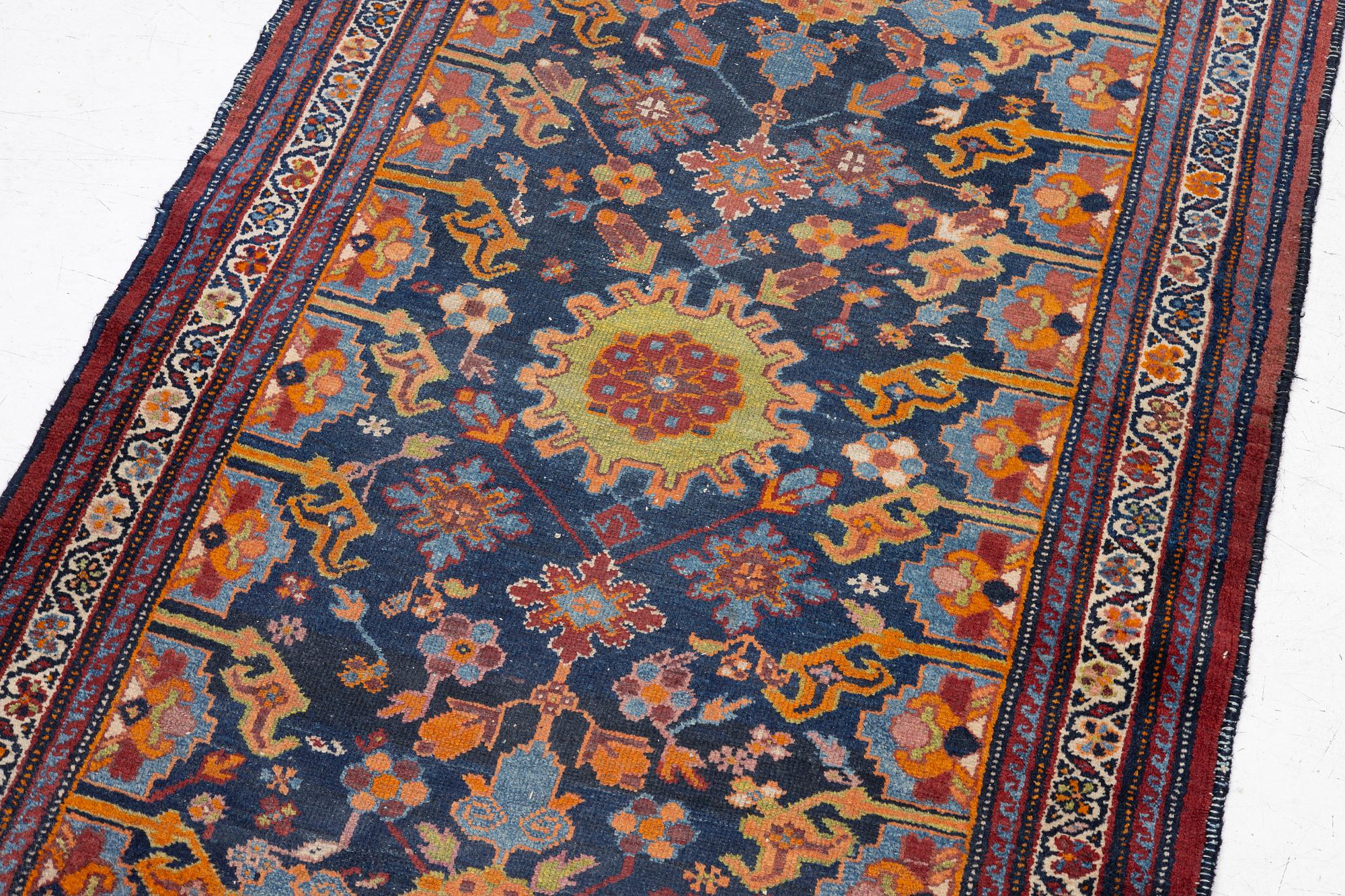 A north-west Persian, semi-antique runner, c. 340 x 110 cm.