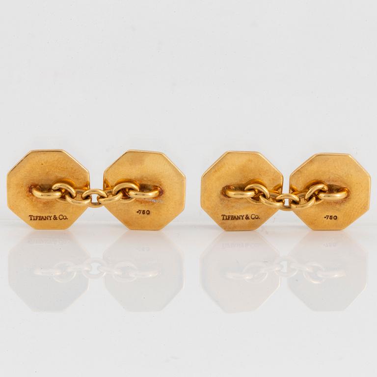 A pair of Tiffany cufflinks in 18K gold with enamel decoration.