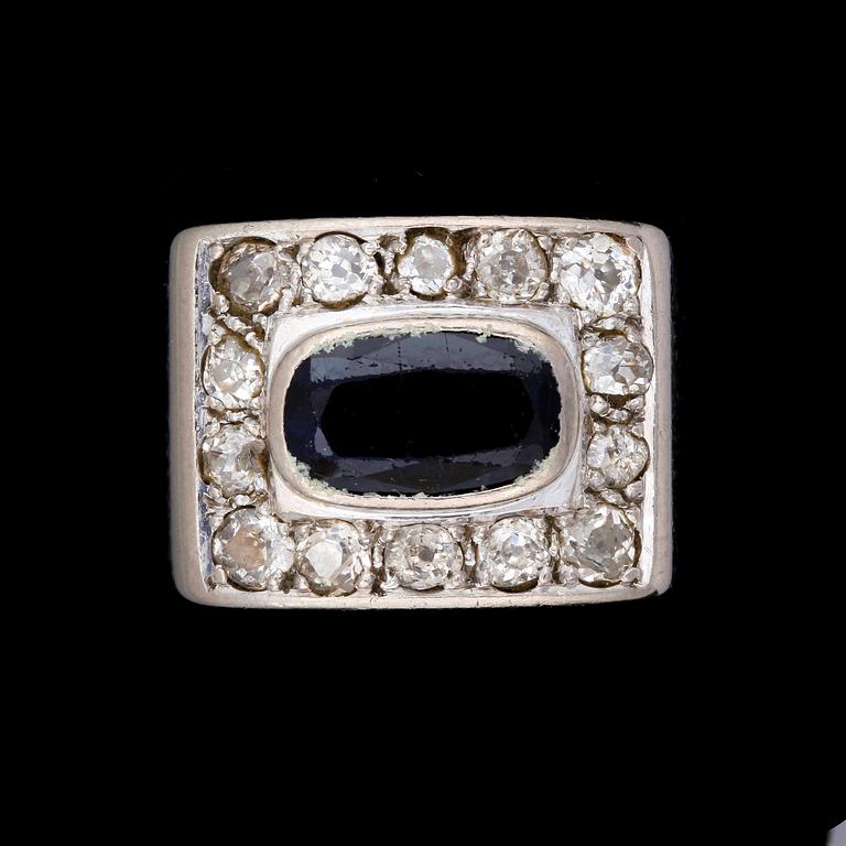 RING, 18k vitguld med blå safir och 14 diamanter tot ca0,56ct, Hovjuvelerare Gunnar Fahlström, Sthlm, 1963. Vikt 11,2g.
