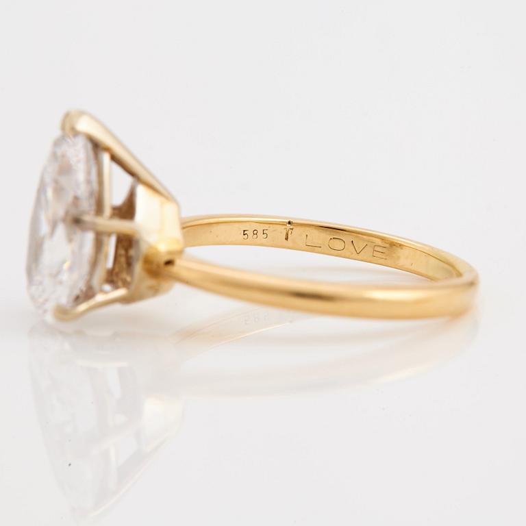 A pear cut diamond ring.