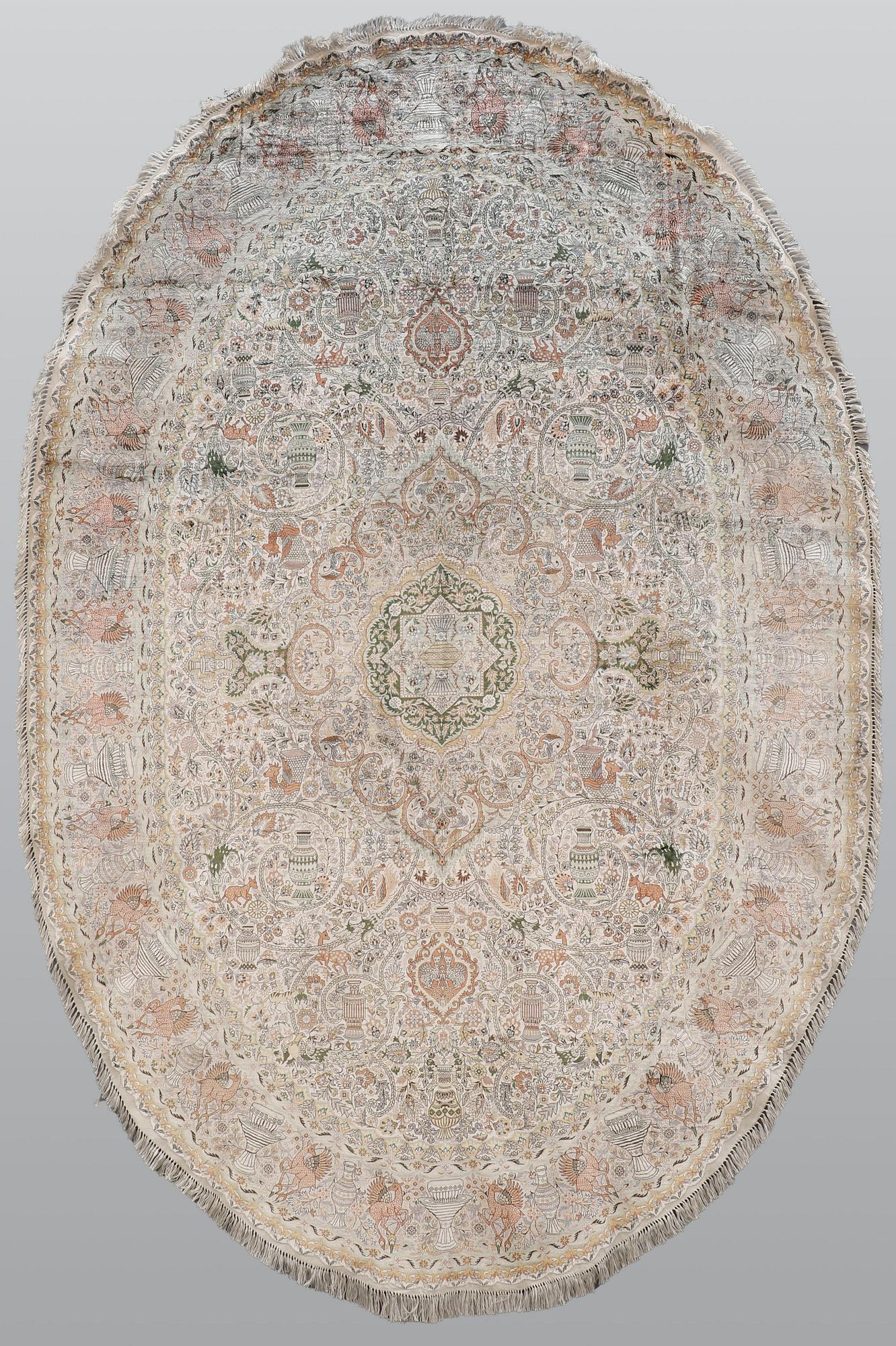 A figural Oriental silk carpet, approx. 273 x 180 cm.