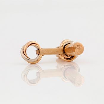 A pair of cufflinks signed Cartier with changeable  details in different gemstones.