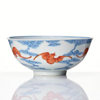 A Chinese iron-red-decorated blue and white Wufu bat bowl, late Qing dynasty, around 1900.