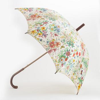 Gucci, a 'Flora' weekend bag and umbrella.