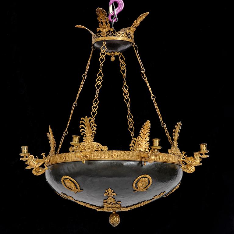 A presumably Russian Empire gilt and patinated bronze nine-branch chandelier, 19th century.