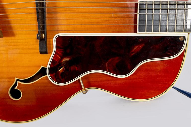 A Crafton Rex acoustic guitar.