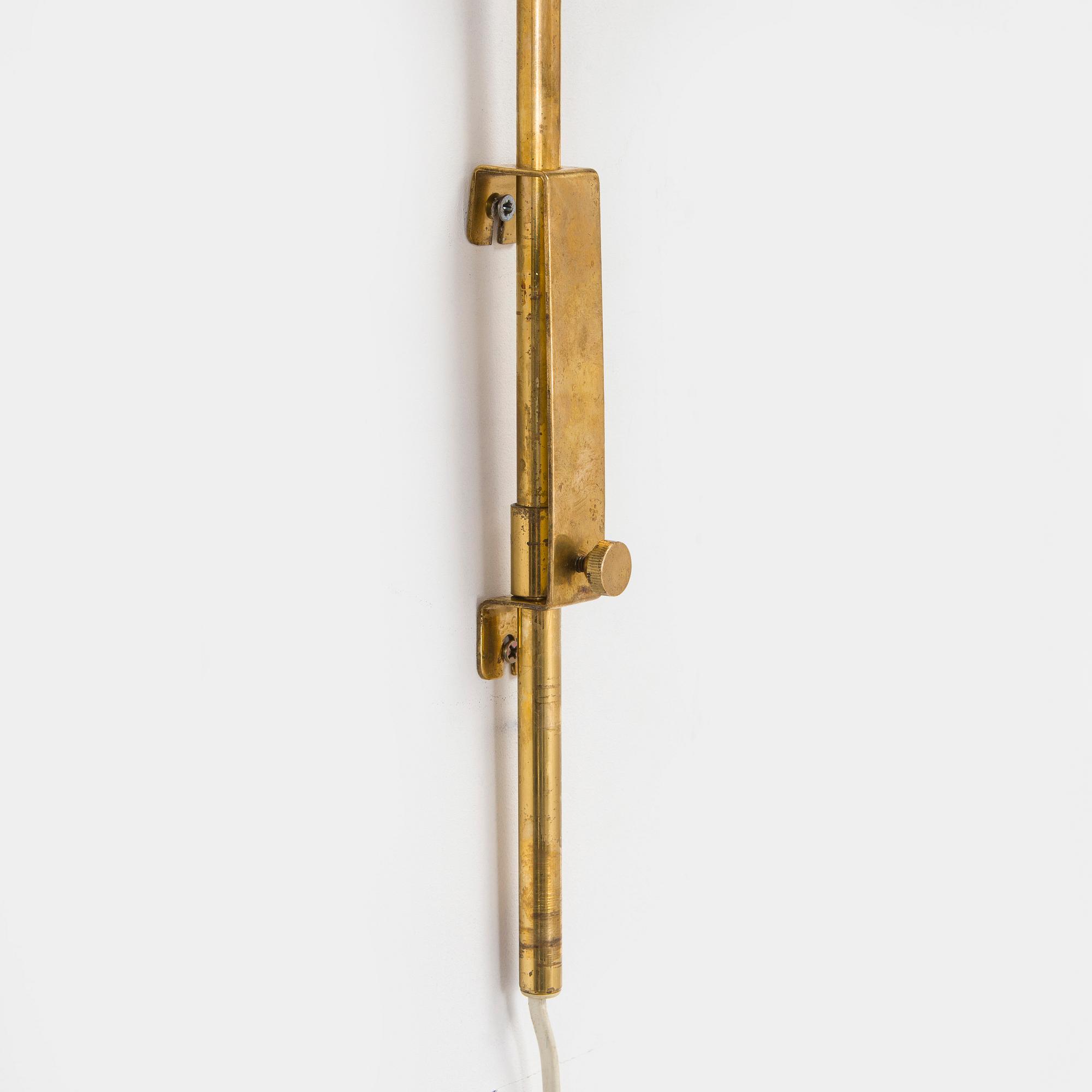 A mid-20th century wall light for Valinte, Finland.