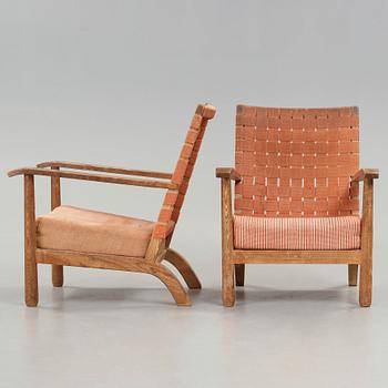 Axel Einar Hjorth, a pair of pine easy chairs, probably model 'Väddö' by Nordiska Kompaniet, Sweden 1930's.