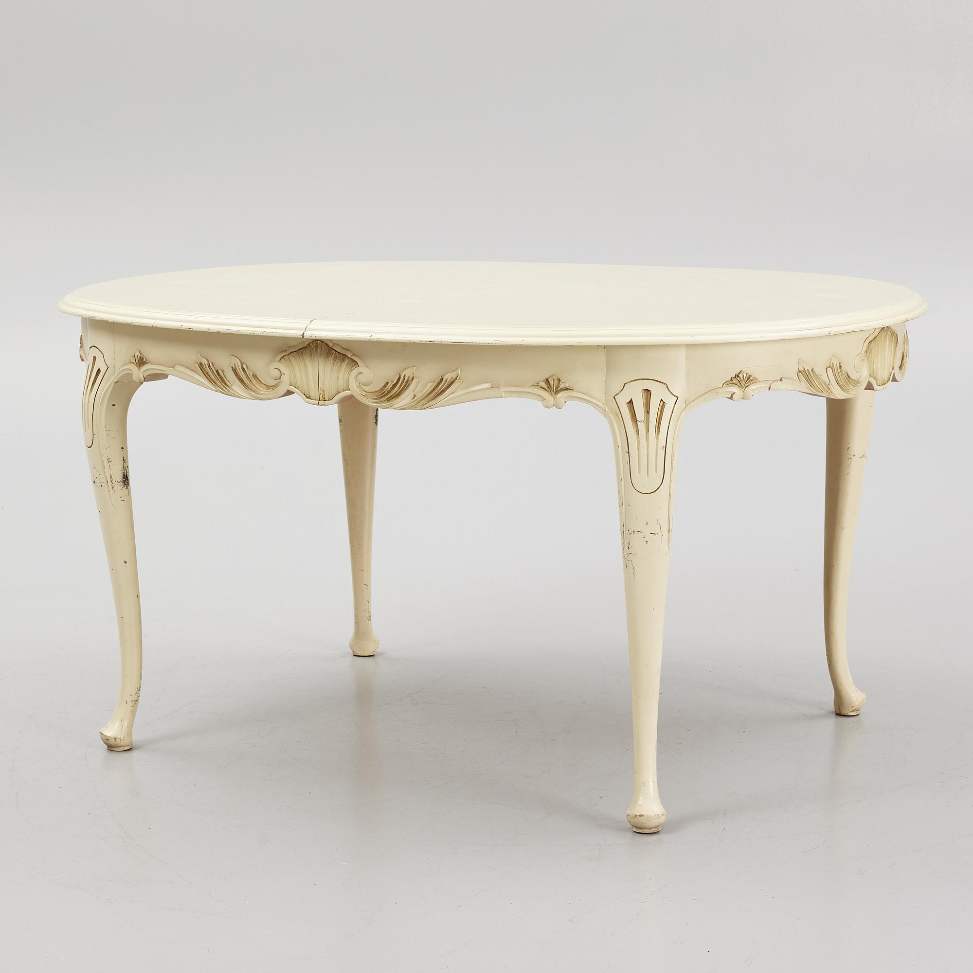 A Rococo style Dining Table with Chairs, first half of the 20th Century.