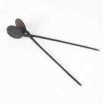 An iron wafer maker, dated 1662.