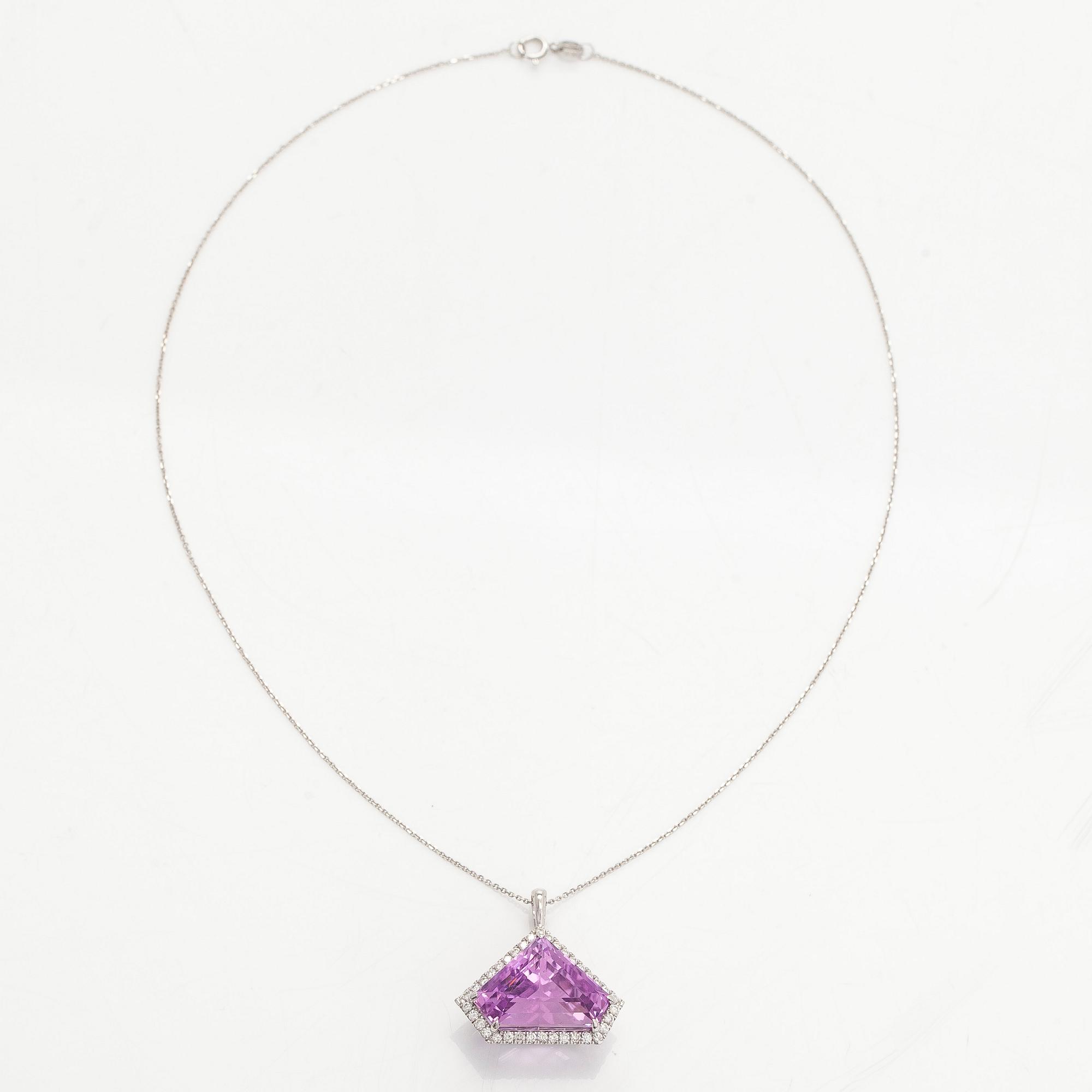 A 14K gold necklace with kunzite and brilliant cut diamonds.