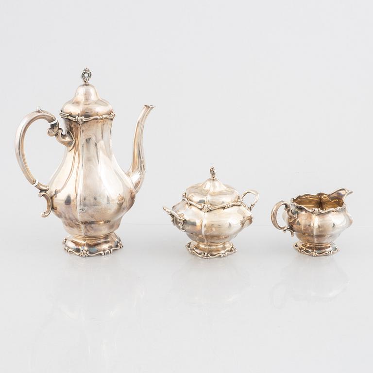A silver coffee pot, cream jug and sugar bowl, Swedish import marks Torndahl-Ekström, Stockholm 1921.