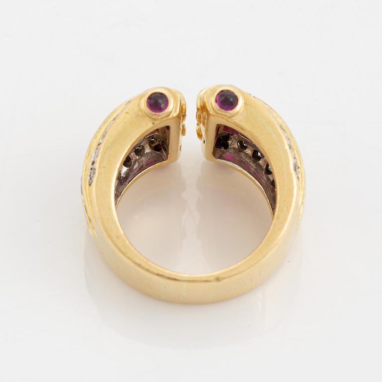 Step cut ruby and brilliant cut diamond ring.