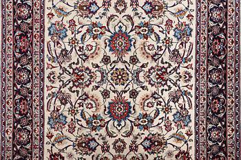 A carpet, Sarouk, part silk, c. 294 x 167 cm.