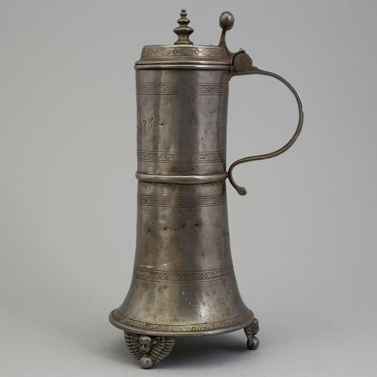 A PEWTER MUG, dated 1776.