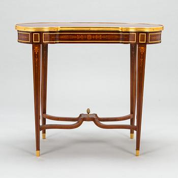 A Directoire style marquetry table from around year 1900.
