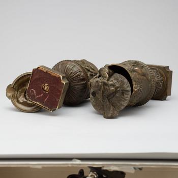 A pair of 19th century bronze urns in the manner of Clodion.