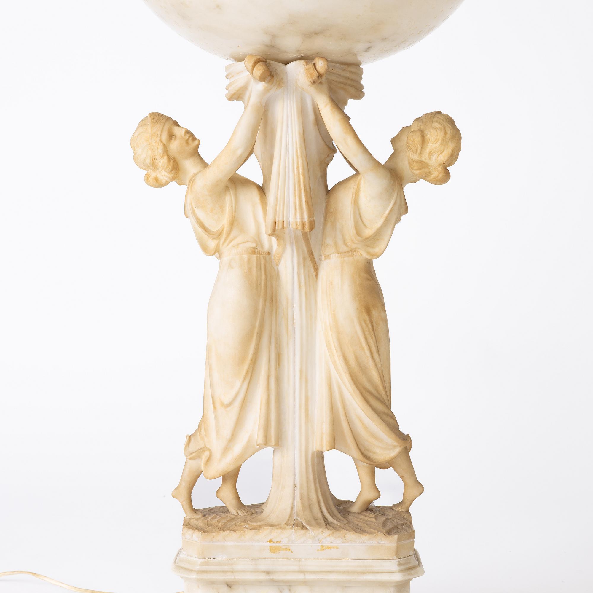 A table lamp on a pedestal, early 20th Century.