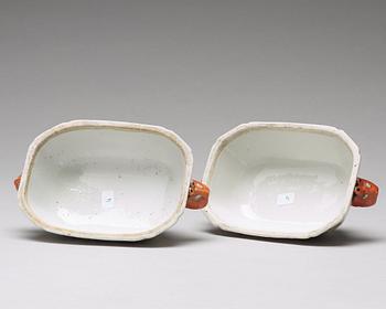 A pair of famille rose 'double peacock' butter tureens with covers and stands, Qing dynasty, Qianlong (1736-95).