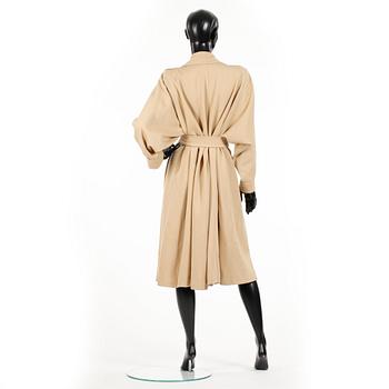 YVES SAINT LAURENT, a beige wool coat.