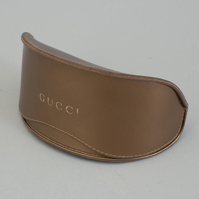 A pair of Gucci GG2970/S sunglasses with case.
