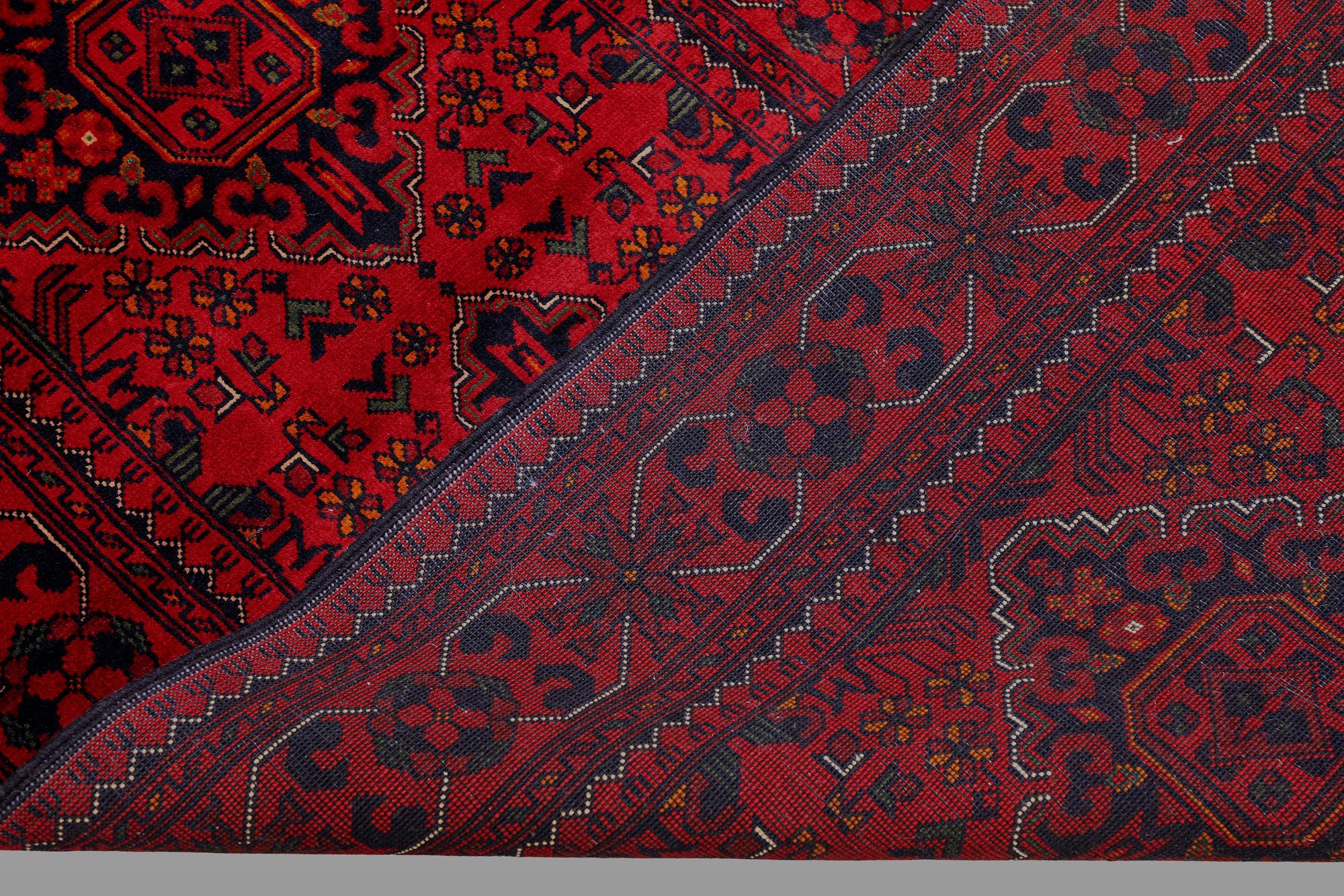 A Afghan runner carpet, 388 x 79 cm.