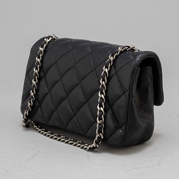 CHANEL, a black leather 'Extra mini flap bag' 2012-13.