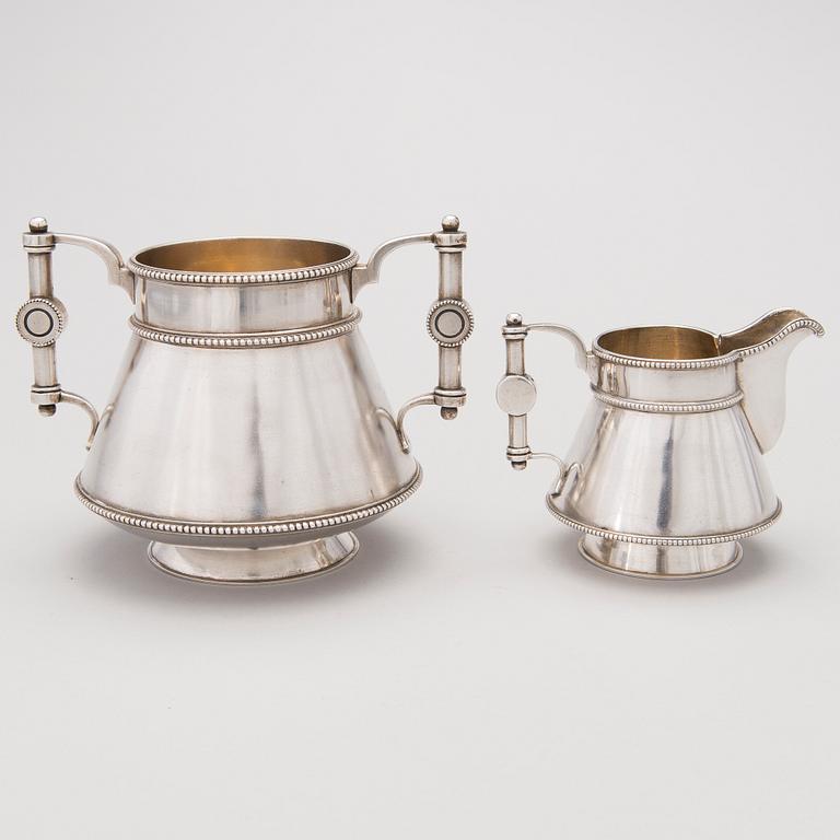 A similar silver sugar bowl and milk jug by Stefan Wäkevä, St.Petersburg 1891 and 1892.