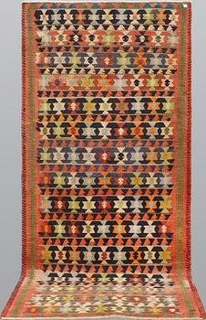 A carpet, Persian Nomad Kilim, ca 324 x 143 cm.