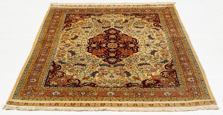 A rug, semi-antique, silke Hereke, signed, ca 184,5 x 118 cm.