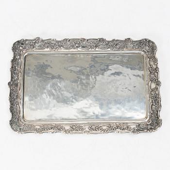 Two creamers, a tray, and a sugar tongs, silver, Rococo and Rococo style, 18th-19th century.