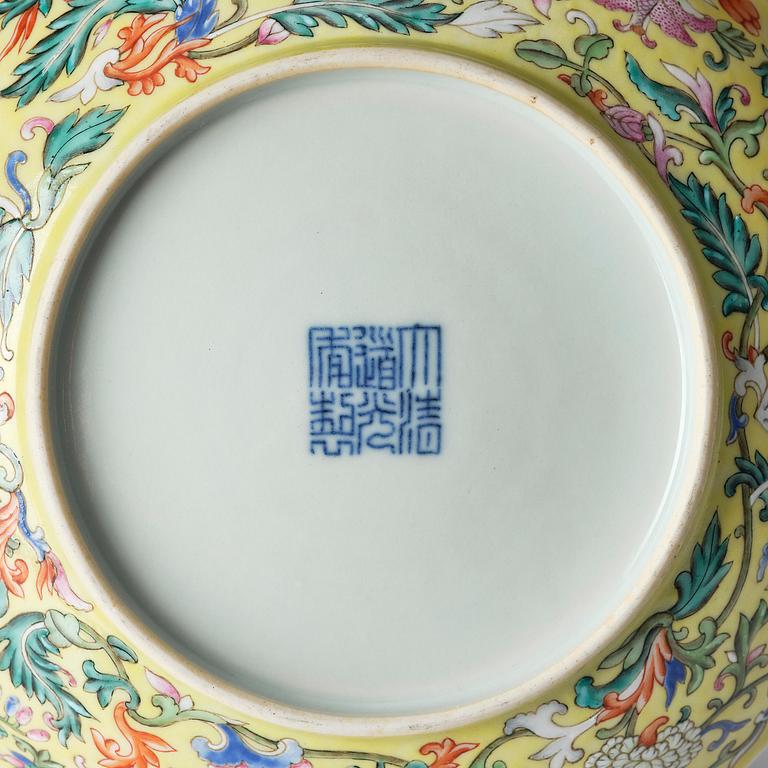 A yellow ground famille-rose 'floral' dish, Qing dynasty, Daoguang seal mark and period of (1821-50).