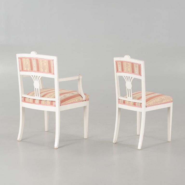 Two gustavian style armchairs and three chairs, first half of the 20th century.