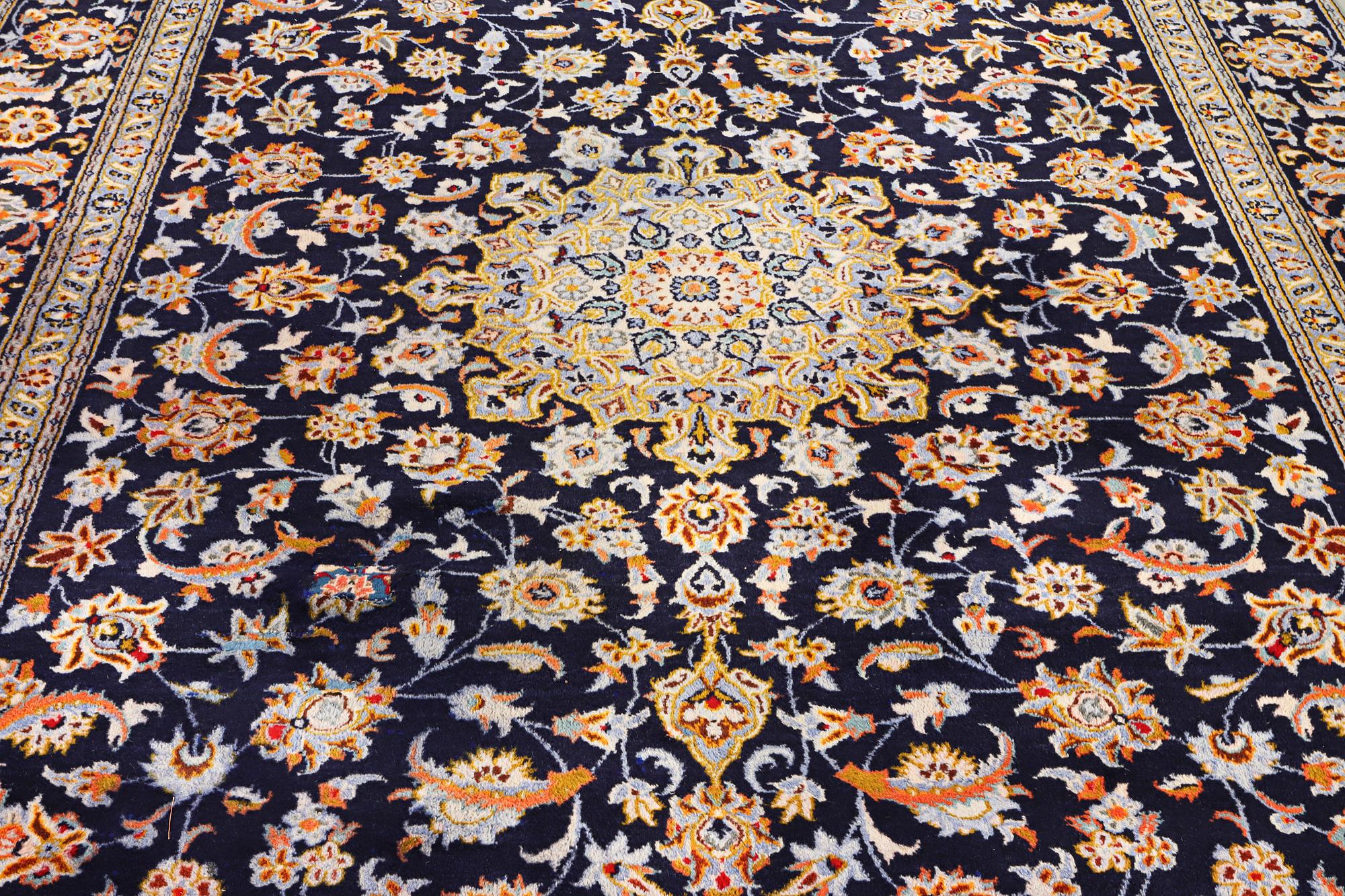 A Kashan carpet, c. 335 x 224 cm.