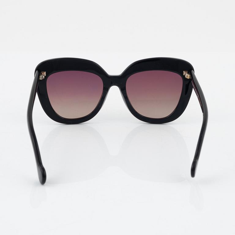 Moncler, a pair of black plastic sunglasses.