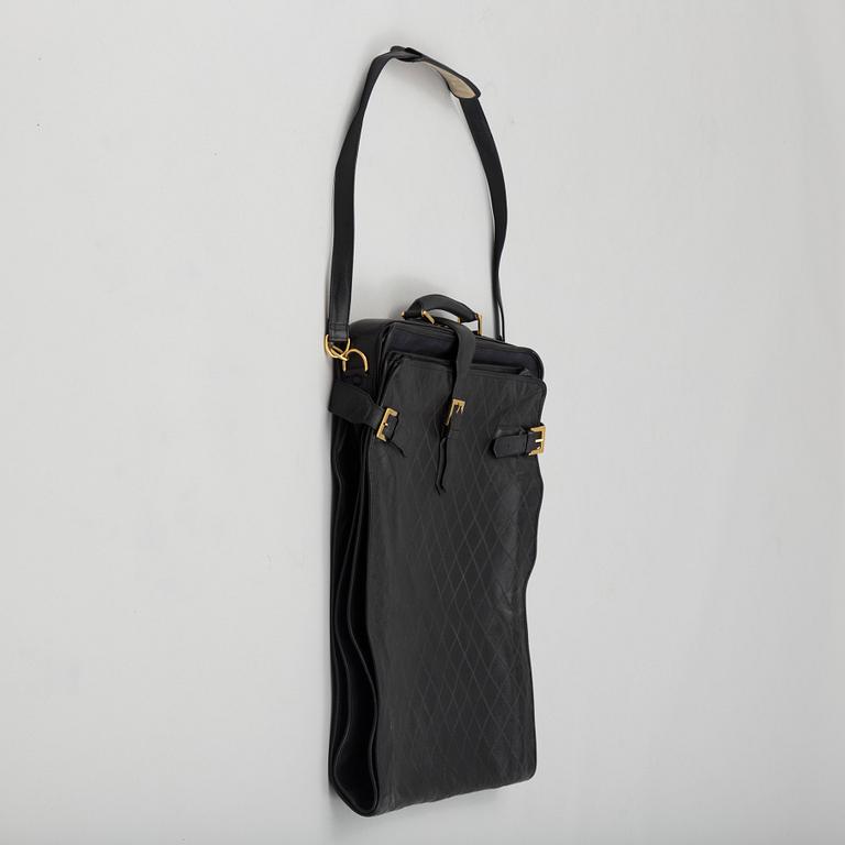 a CHANEL garment bag.