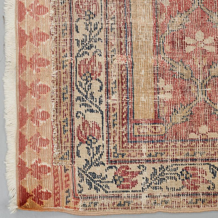 A CARPET FRAGMENT, an antique Indian, Mughal Empire 17th-18th century probably, saf, ca 277 x 136 cm.