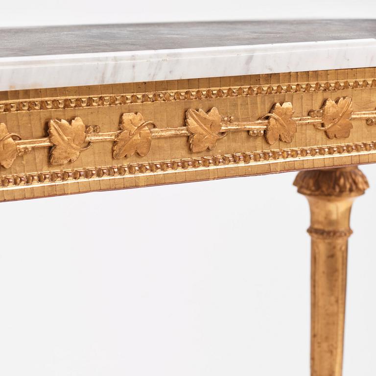 A Gustavian carved giltwood and marble console by O. C. Lindmark (master in Stockholm 1779-1813).