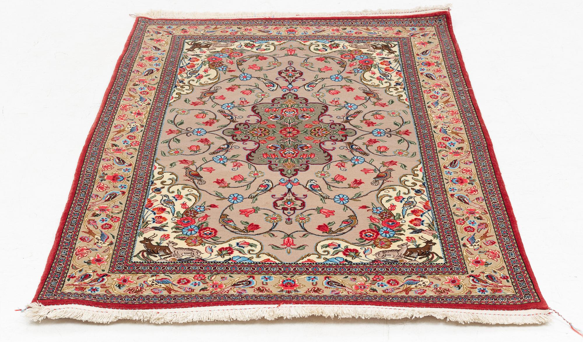 A Ghom rug, c. 160 x 105 cm.
