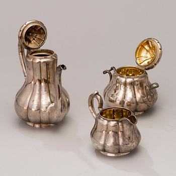 A 3-piece Russian silver coffee set, marks of Sazikov, St Petersburg 1869-70.