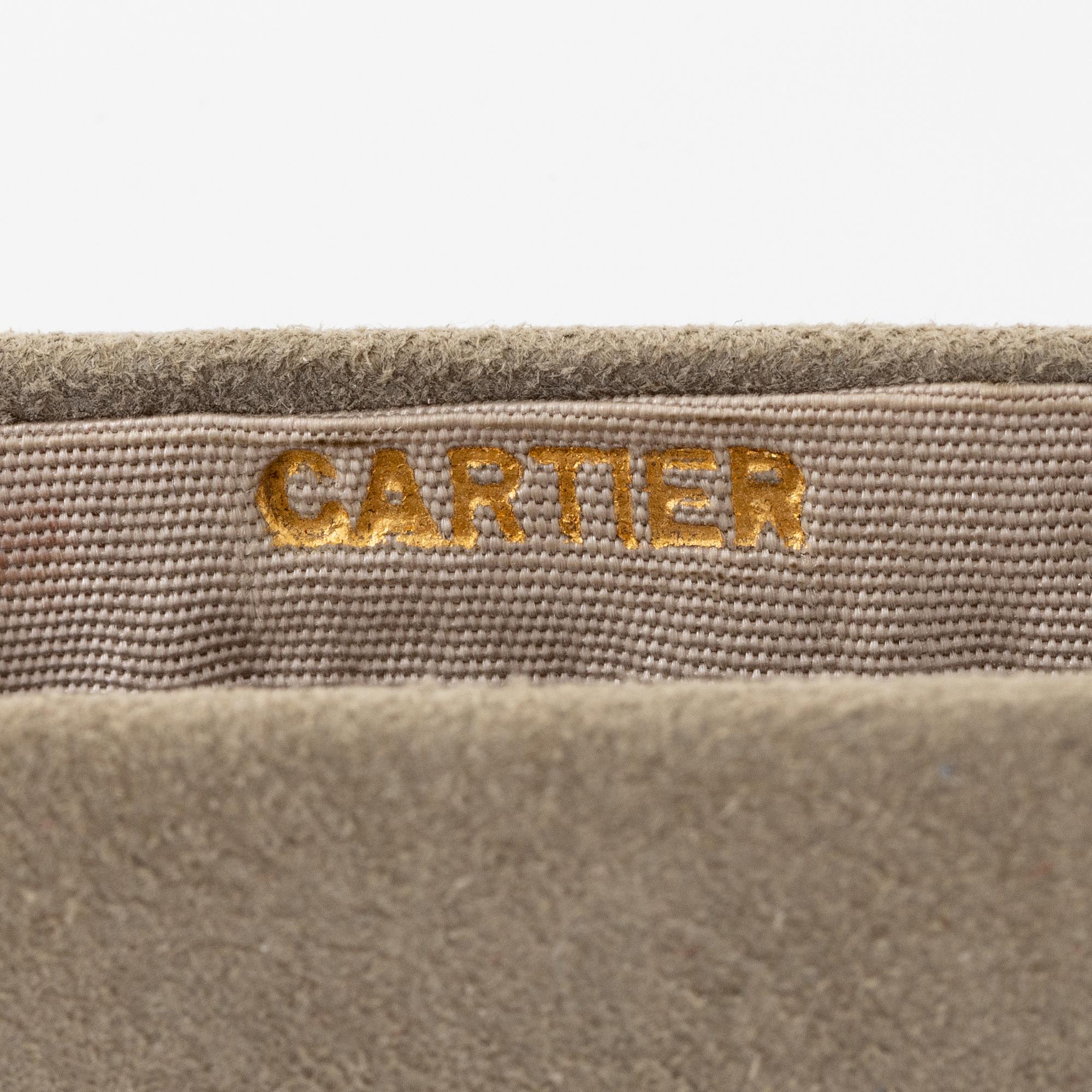 Powder box, signed Cartier, sterling silver and 14K gold with three sapphires.