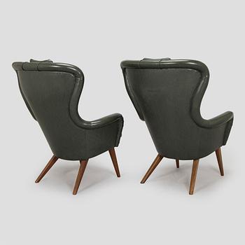 A pair of mid-20th century armchairs.