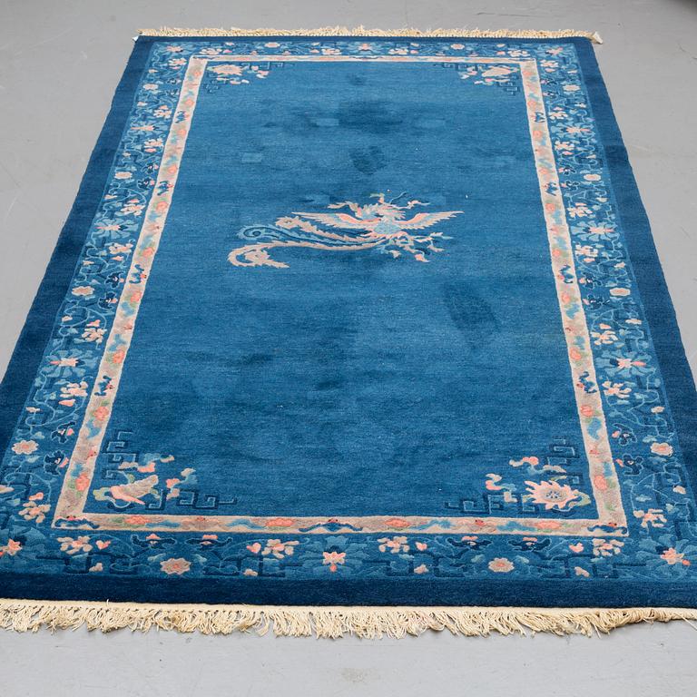 A CARPET, an old China, ca 295 x 153 cm (as well as 2 cm flat weave at the ends).