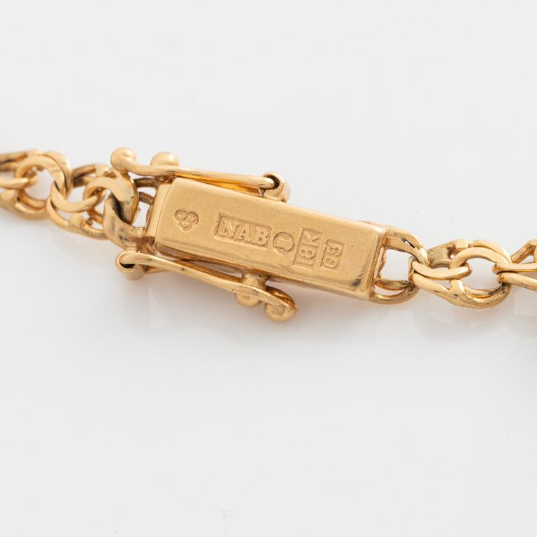 Armband med berlocker 18K guld.