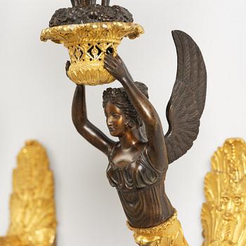 A pair of French Empire five-branch gilt and patinated bronze appliques, first part 19th century.