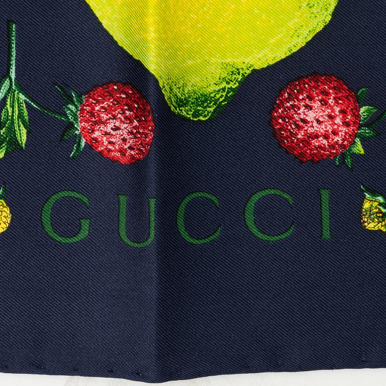 Gucci, a silk scarf.