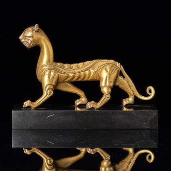 An elegant gilt bronze sculpture of a tiger, Six dynasties, or earlier.